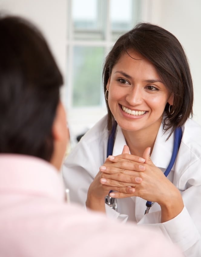Doctor listening to a patient at her practice-1